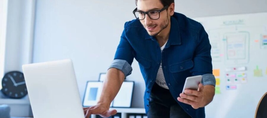 man in front of a computer
